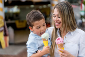 A mother and son are pictured here eating ice cream.